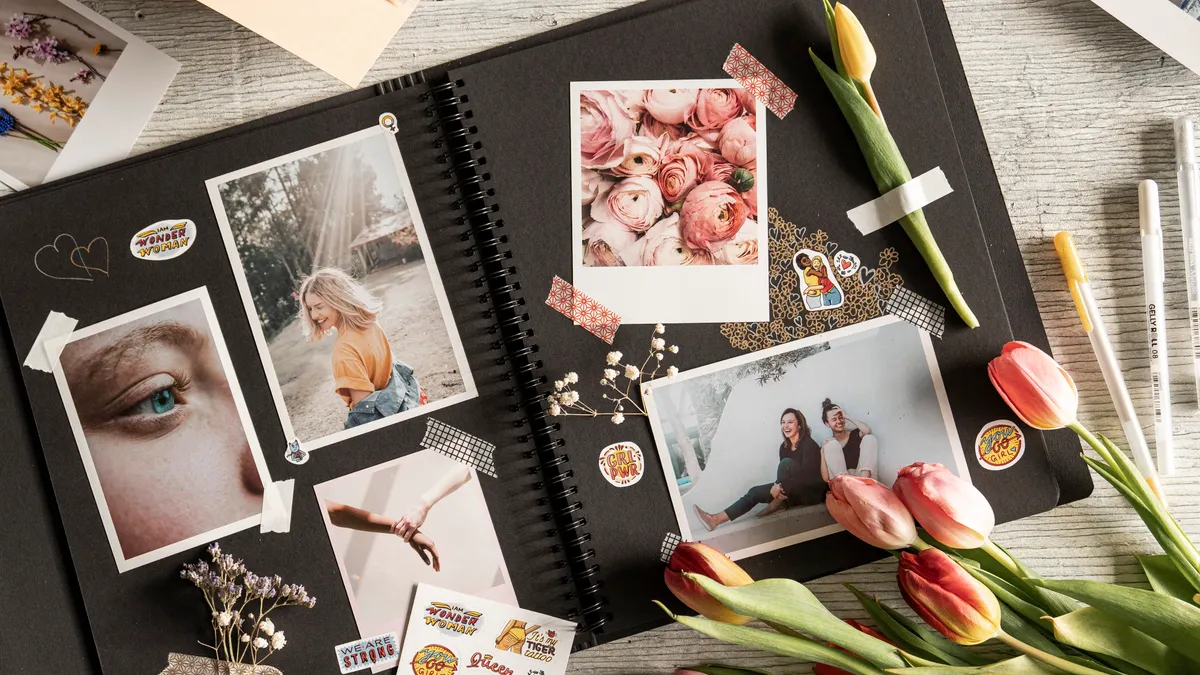 Open scrapbook with photos and floral decorations