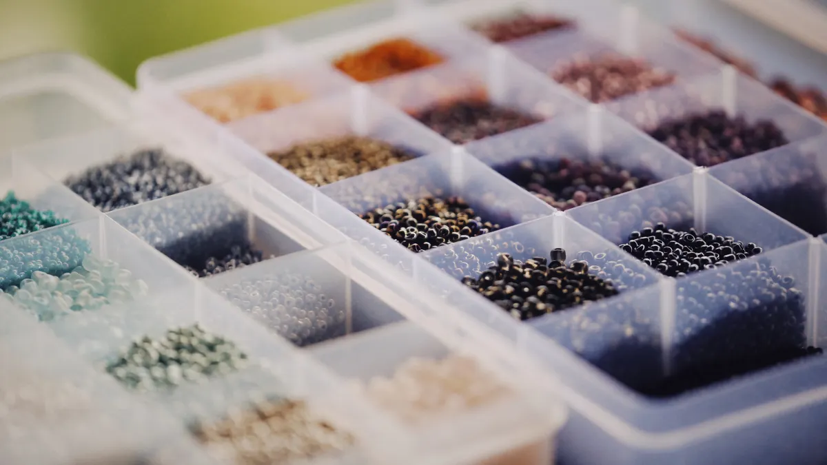 Plastic compartment box with tiny craft beads