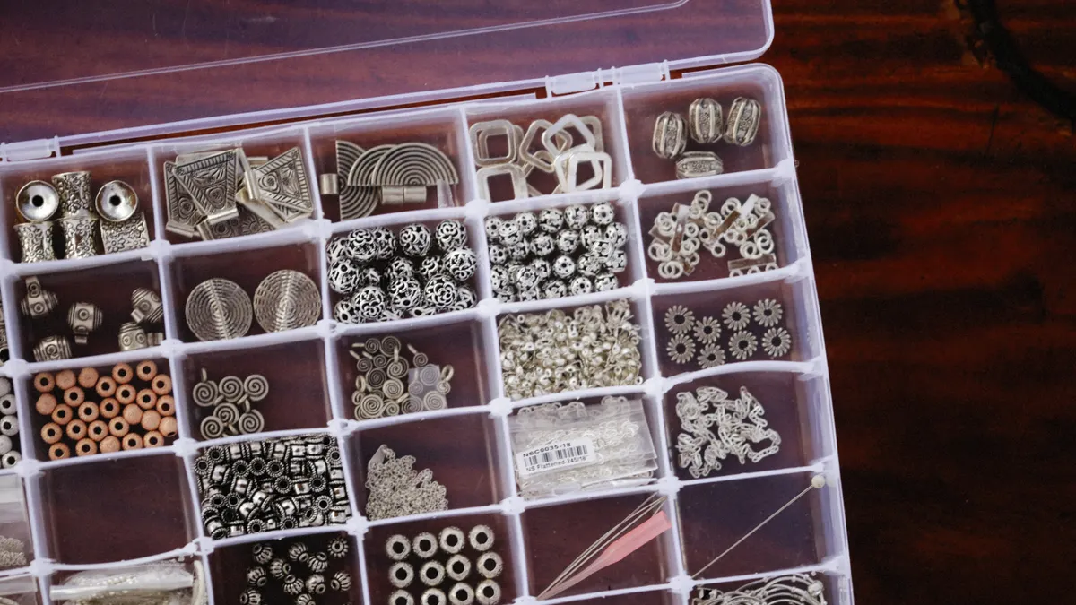 Organizer tray filled with small metal craft pieces