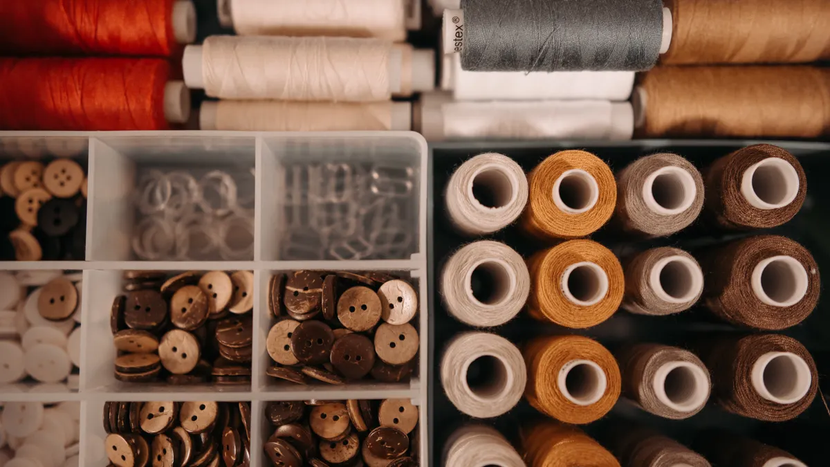 Drawer organizer with ribbon rolls and buttons